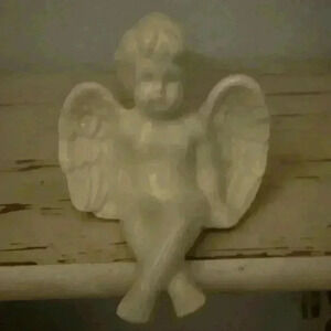 Baby Porcelain Figurine sitting for shelf ledge has a couple blemishes noted